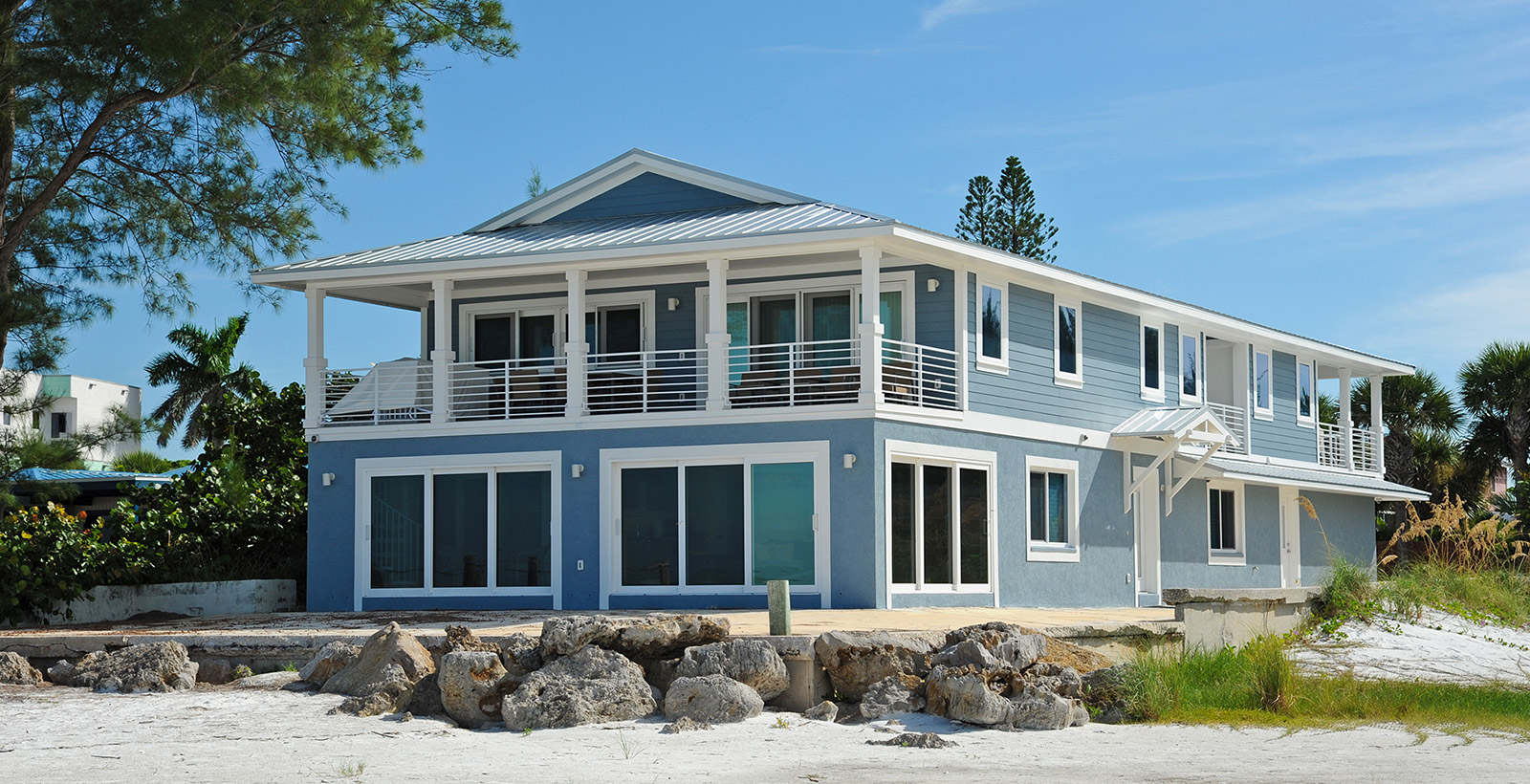 Learn about the best practices for building storm-resistant waterfront custom homes.